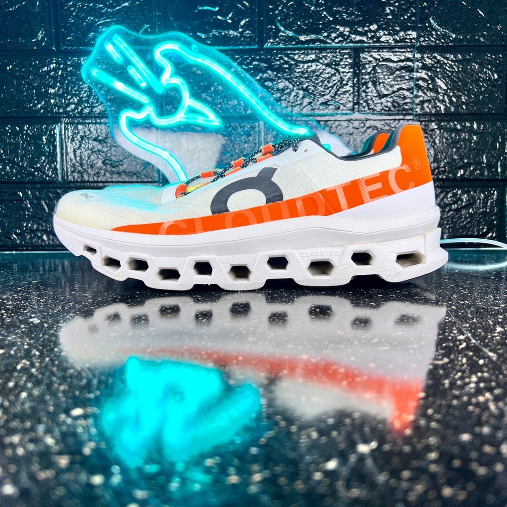 On Running Orange and White Athletic Shoes